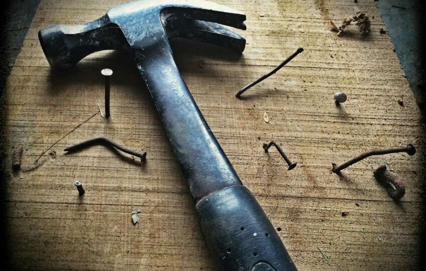 Black Claw Hammer on Brown Wooden Plank