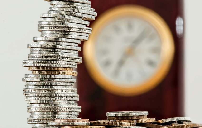 Selective Focus Photo of Stacked Coins