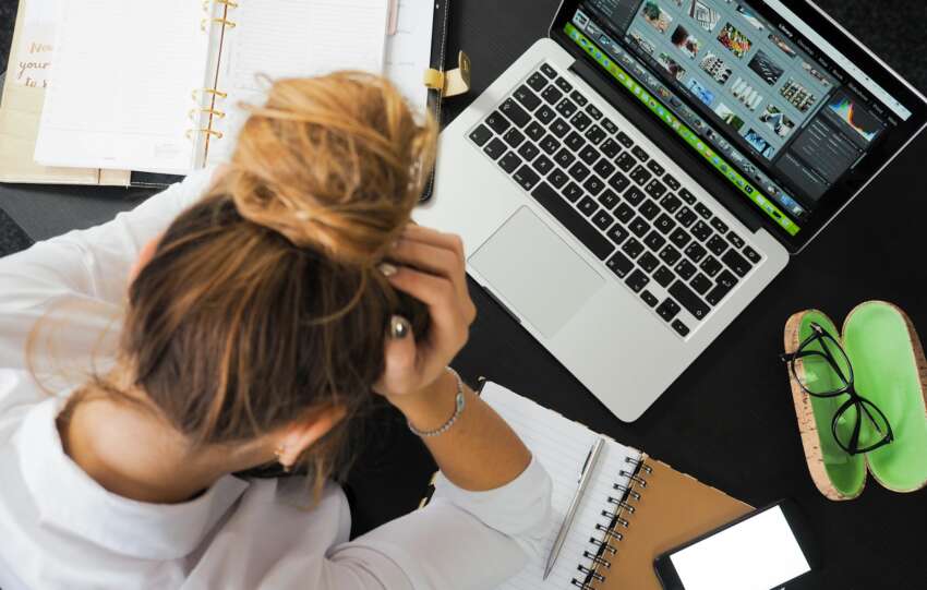 Woman Sitting in Front of Macbook