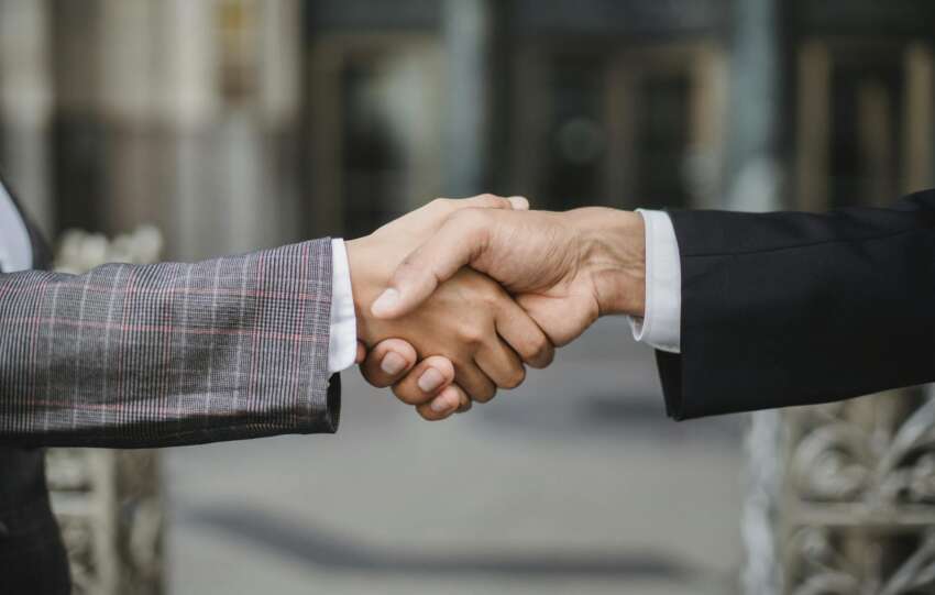 Two People Shaking Hands 