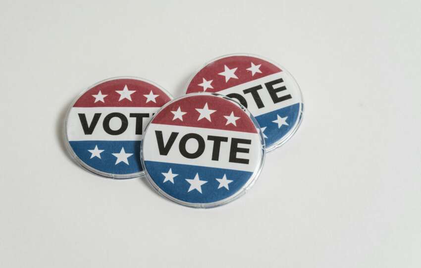 US Voting Badges on White Surface