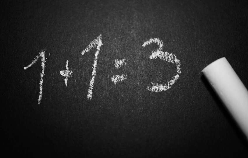 Chalkboard with a humorous incorrect math equation, ideal for educational settings.