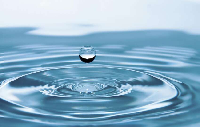 A mesmerizing shot of a water droplet capturing the beauty of liquid dynamics.