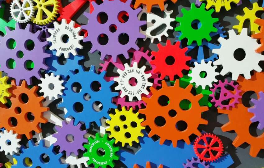 A colorful arrangement of gears symbolizing creativity, innovation, and machinery in vibrant colors.