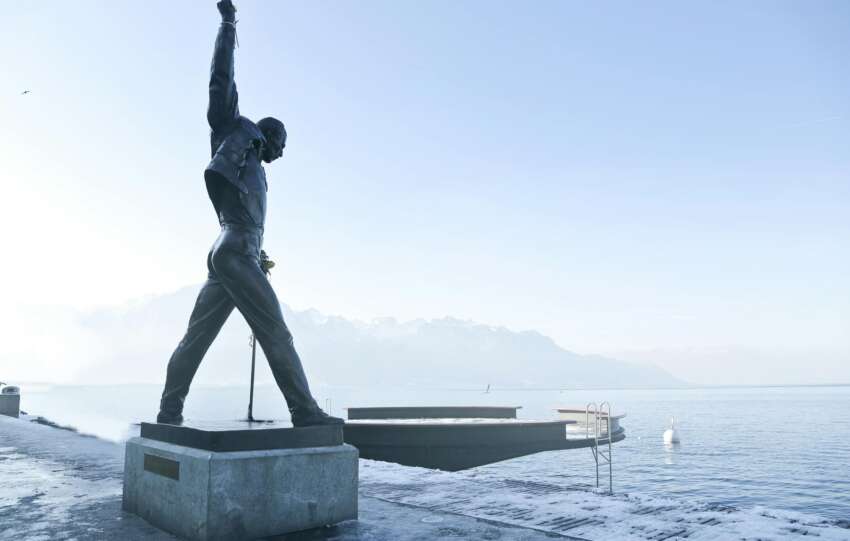 Iconic Freddie Mercury statue on Lake Geneva in Montreux, captured in a serene and foggy morning.