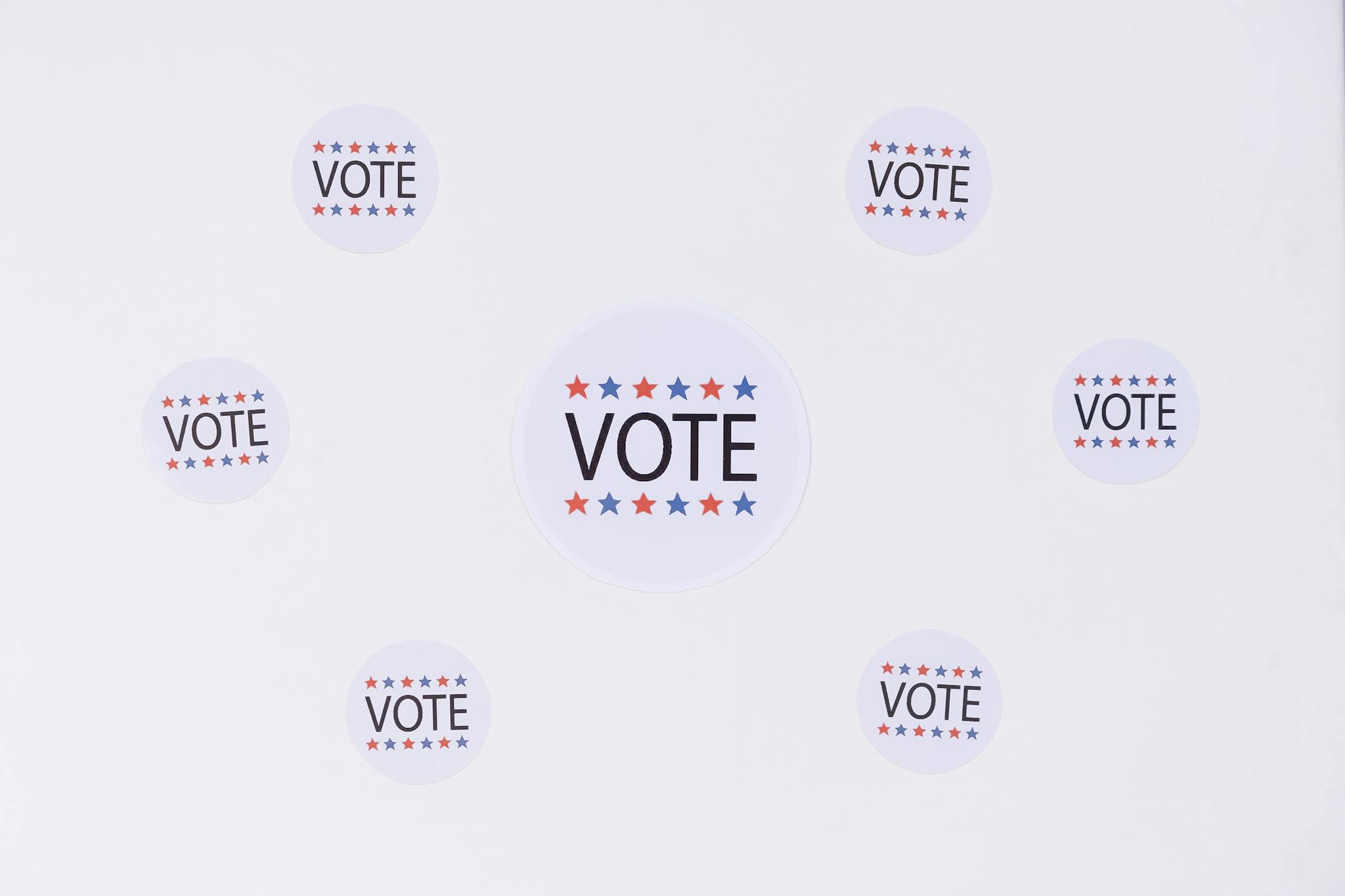 Circular stickers with 'Vote' text and stars emphasizing a voting campaign.