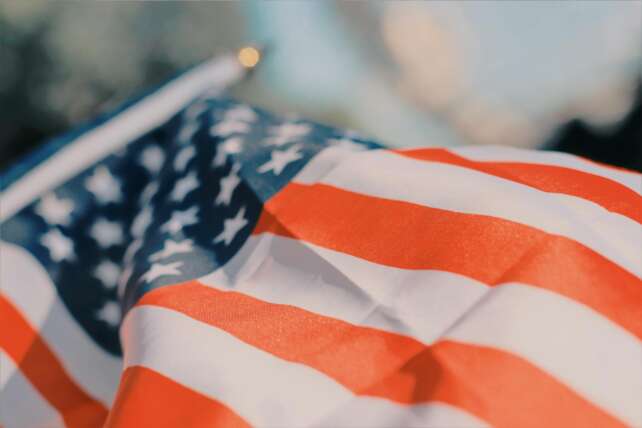 Close-up of a wavy American flag representing patriotism, freedom, and independence.